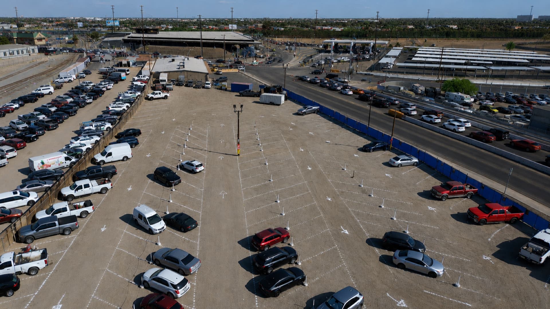 Park Calexico lot entrance with its banners and the Calexico port of entry in the background